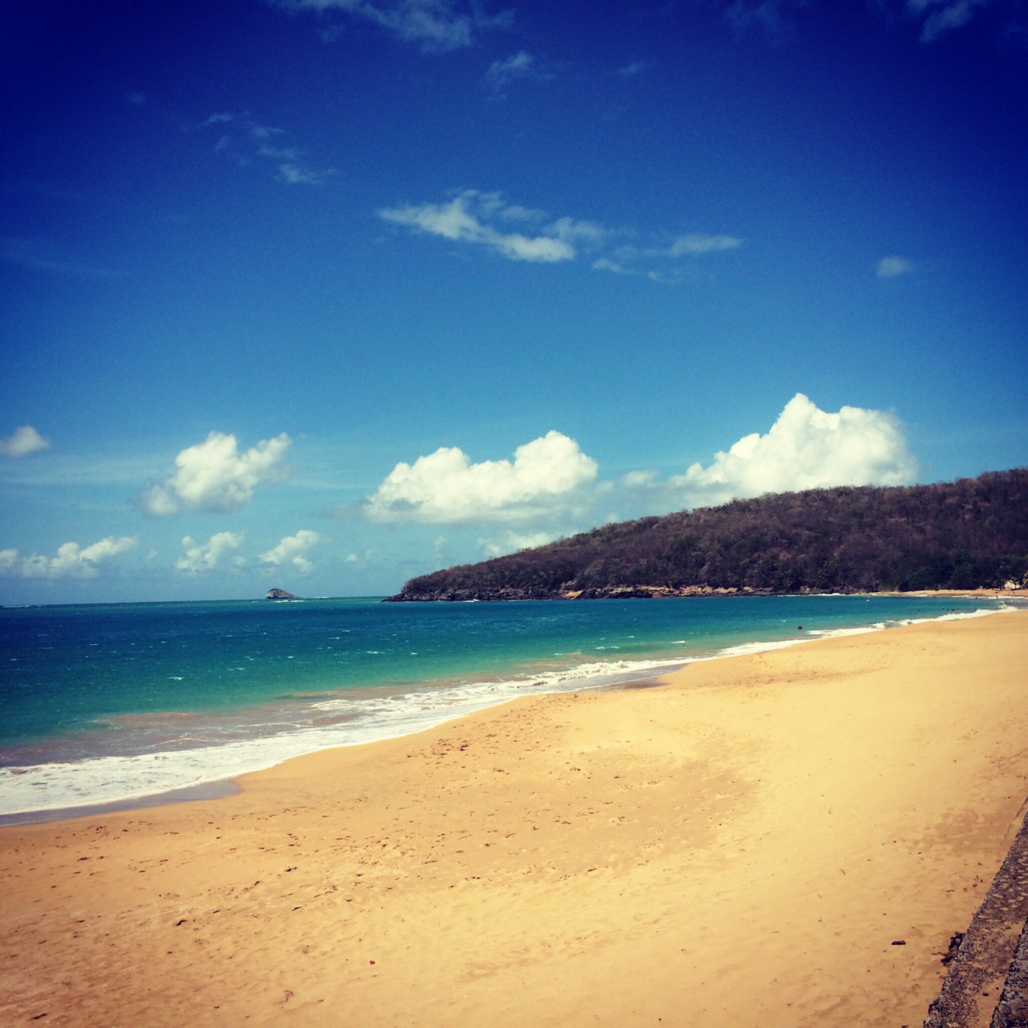 Golden beach, turquoise sea and headland scouted in the Caribbean