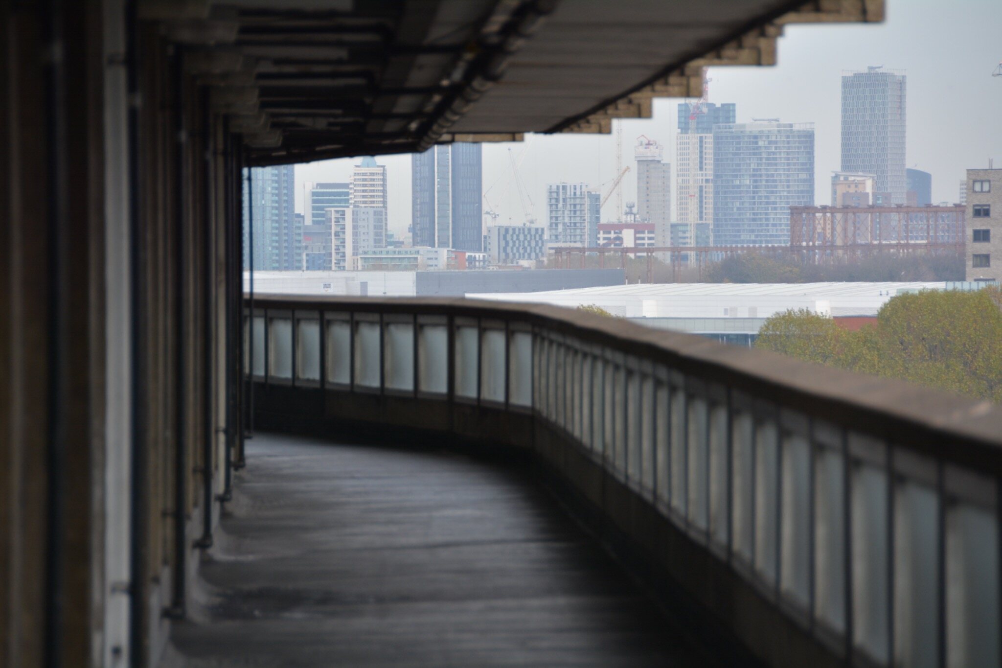 Concrete riverside walkway and city skyline scouted in London