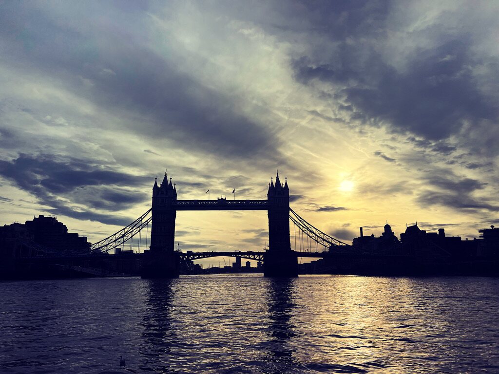 Tower Bridge silhouetted at sunset over the River Thames in London